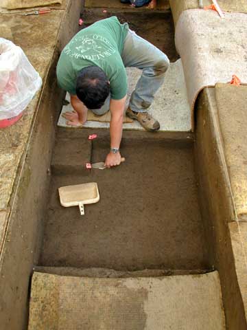 Andy Davis excavating flotation sample