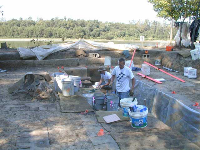 Two people working the excavation site