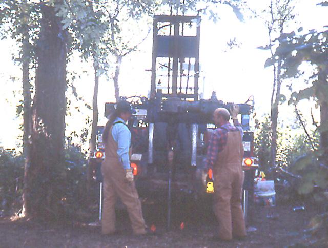 Jay Arnold and Leonard Middleton use the Indiana Geological Survey drill rig to extract soil cores