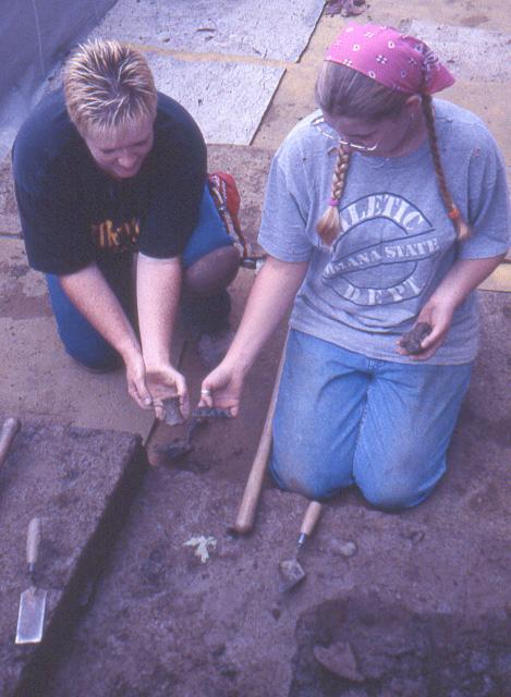 Tammy Reece and Sarah Arthur comparing pottery sherds