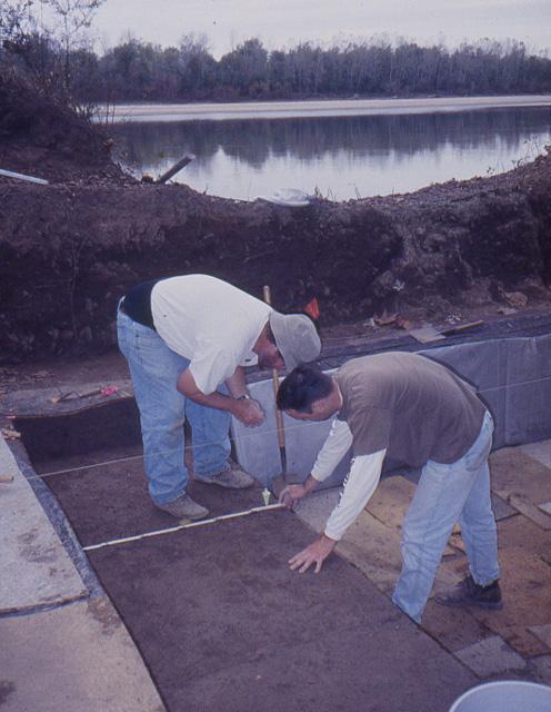 Jeff Brown and Kris Suthers measure 1-meter excavation units