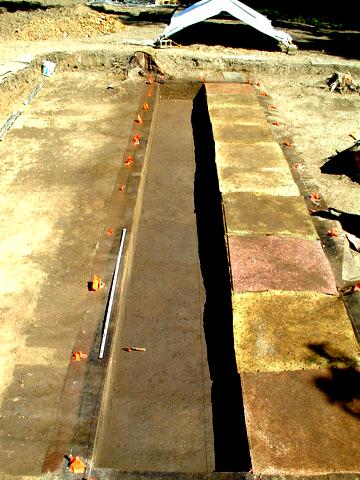 Block 2: Units 4A-4J at the base of level 5 showing the dark midden deposits (Zone B) in the foreground closest to the riverbank