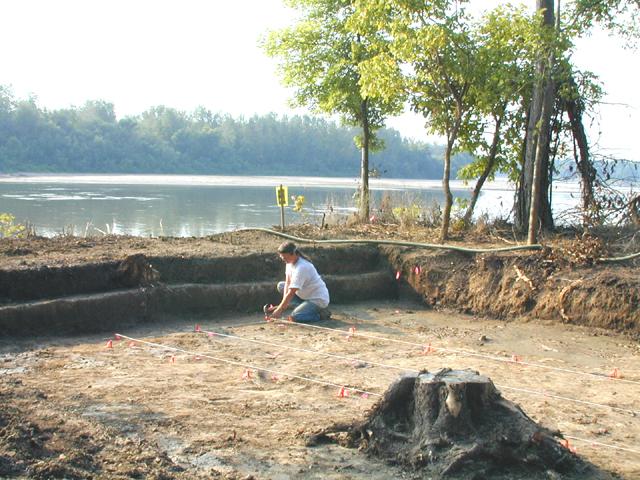 Block 2: Initial layout of excavation units within a 2 x 10 m area. Strings mark the sides of Units 4A-4J and 4K-4T. Nails with pink tape mark the corners of the units.