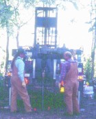 Two workers in front of Indiana Geological Survey drill