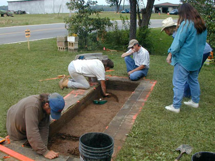 Jocelyn Turner and Jon Criss excavating Block 11 while visitors from the 2003 Open House ask questions