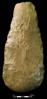 A complete hoe made from Dover chert. The lower right side shows removal of flakes to resharpen the bit which had been dulled by use and polish