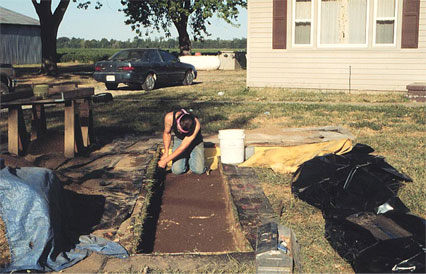 Rexford Garniewicz excavating in block 5